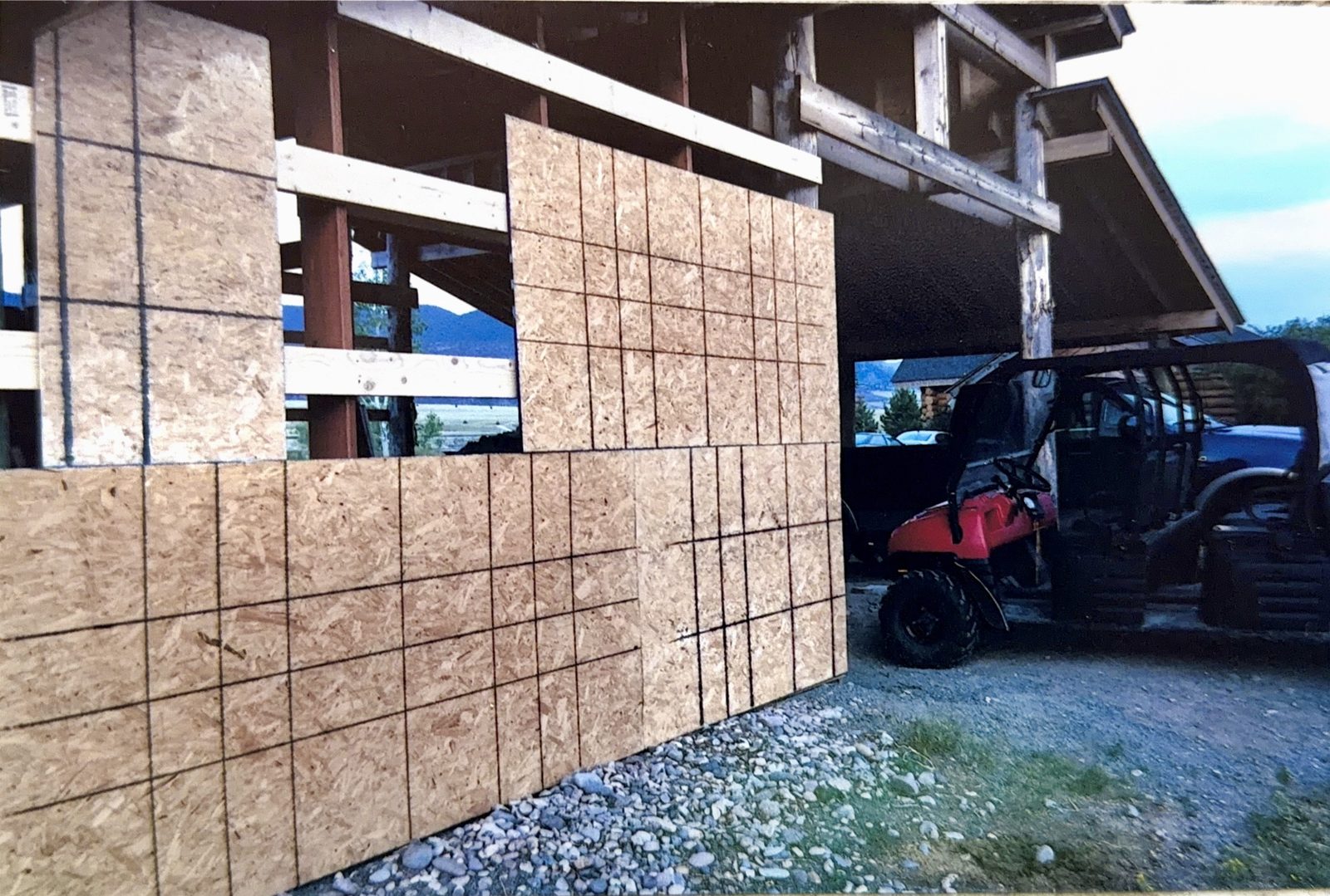 Sheathing going up on one of the outbuildings.